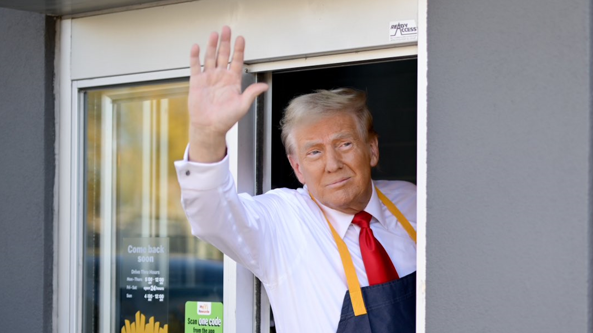 Trump waving goodbye from the McDonald's drive-thru window. 