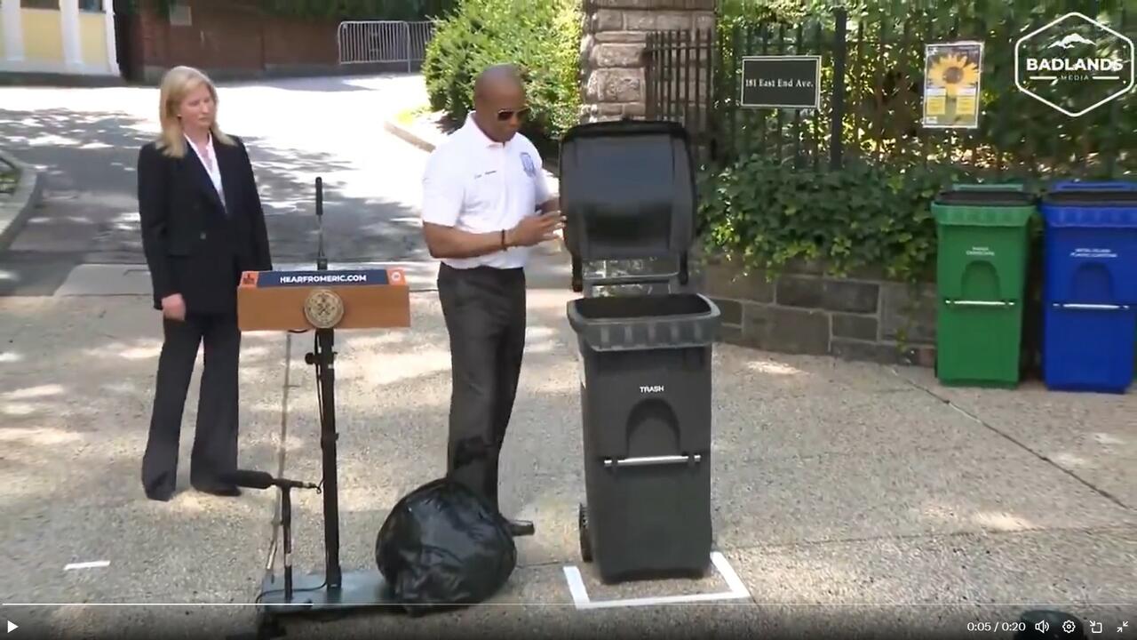 Mayor Adams and a garbage can.