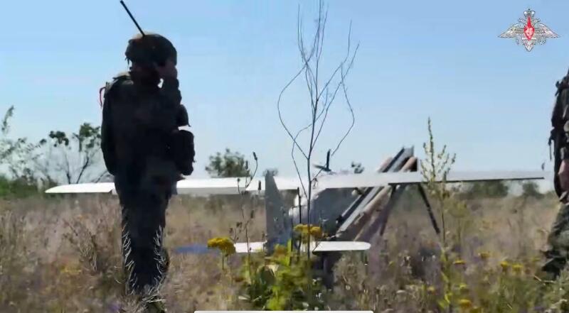Russian soldiers in Ukraine prepare to launch a drone (Screen capture via Russia's Ministry of Defense). 