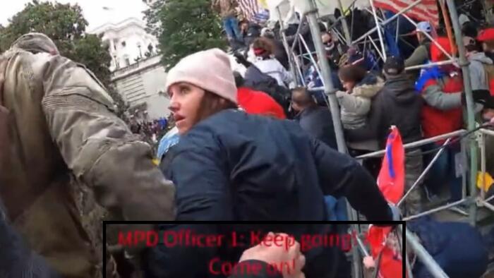 NextImg:'Go, Go, Go! Help Them Up! Push Them Up': New Leaked J6 Footage 'Shows DC Metro Cop Encouraging People To Go Towards The Capitol'