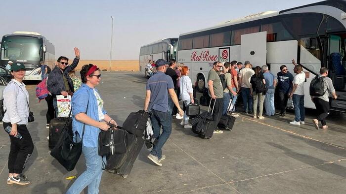 NextImg:Drone-Escorted Buses Evacuate Hundreds Of Americans To Port Sudan