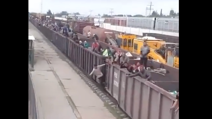 NextImg:Watch: Freight Train Full Of Migrants Heading To Southern US Border