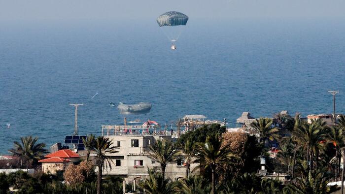 NextImg:Watch: Surreal Images As Humanitarian Air Drop Over Gaza Goes Wrong