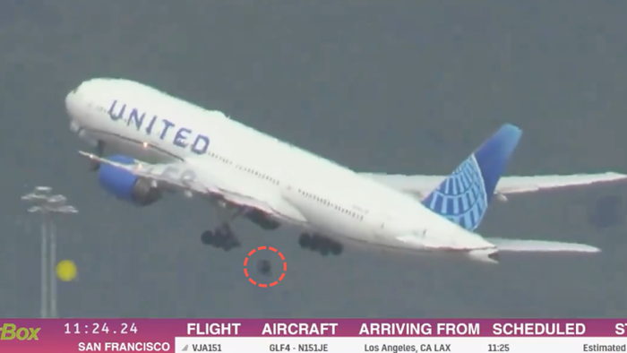 NextImg:Tire Separates From Boeing 777, Crushes Cars In San Francisco Parking Lot