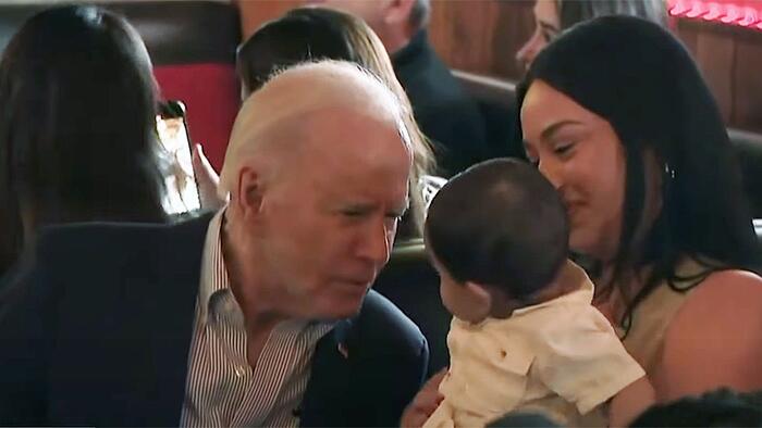 NextImg:Watch: Biden Bizarrely Wanders Off Stage Mid Event To Pull Faces At A Baby