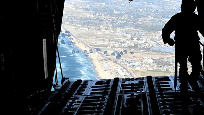 NextImg:New Footage Shows Thousands Of Gazans Clamoring To Access US Aid Dropped From C-130s