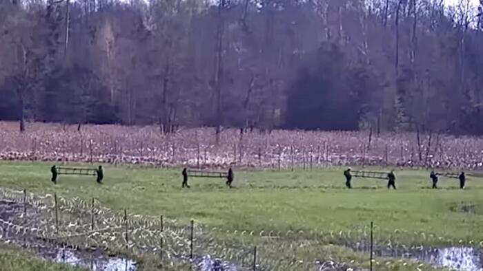 NextImg:Watch 'Weaponized Migration' In Action: Hundreds Storm Polish Border From Belarus