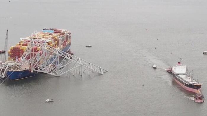NextImg:Port Of Baltimore Partially Reopens, Allowing Trapped Cargo Ships To Exit