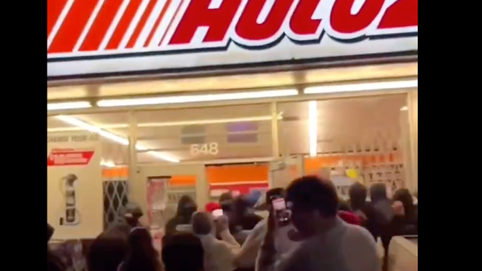 NextImg:Watch: Mob Loots AutoZone In South LA During Chaotic Street Takeover 