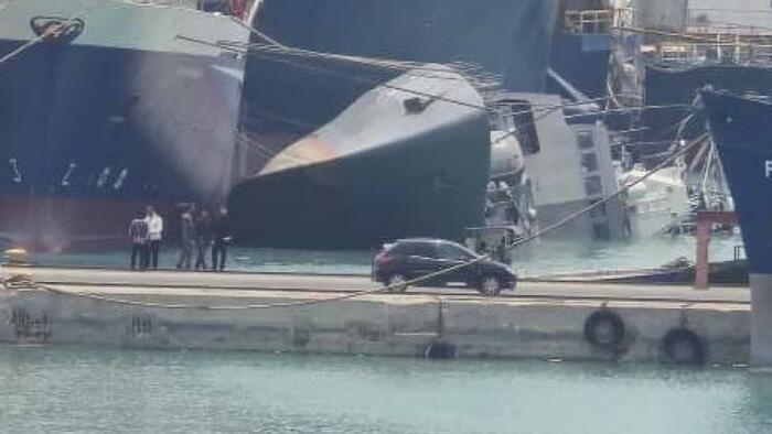 NextImg:Images Show Iranian Warship Capsized At Port