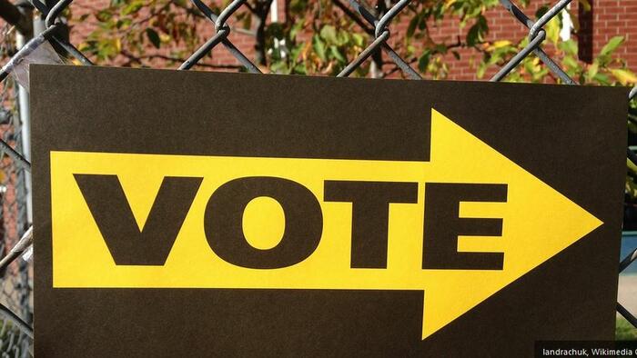 NextImg:Make Election Day A Federal Holiday, Require In-Person Voting