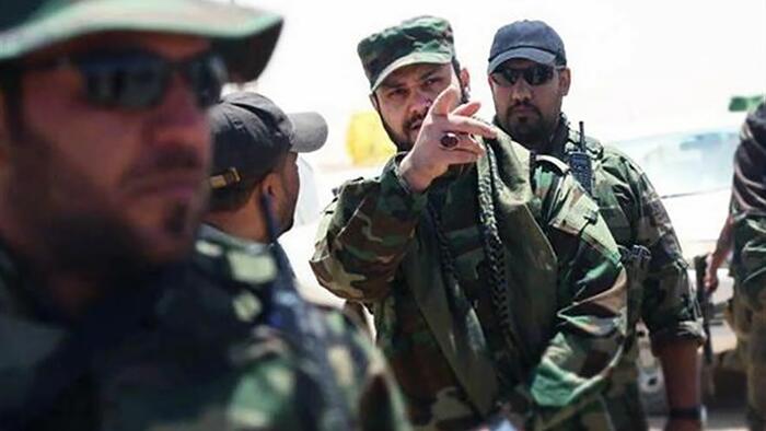 NextImg:Iran-Backed Iraqi Militias Pour Across Border Into Syria To Bolster Assad