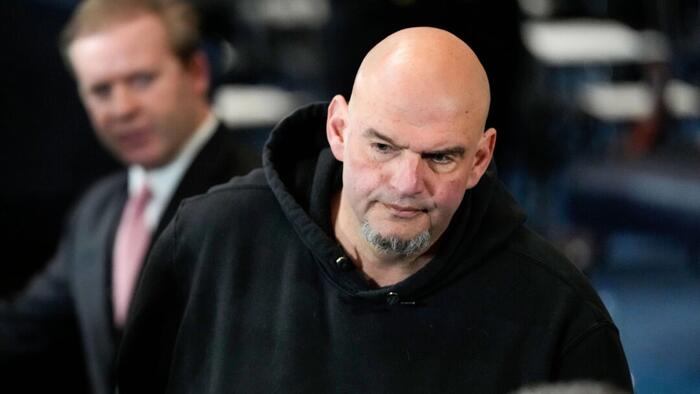 NextImg:Fetterman Votes With Republicans To Advance Hegseth, Says He Won't Switch To GOP