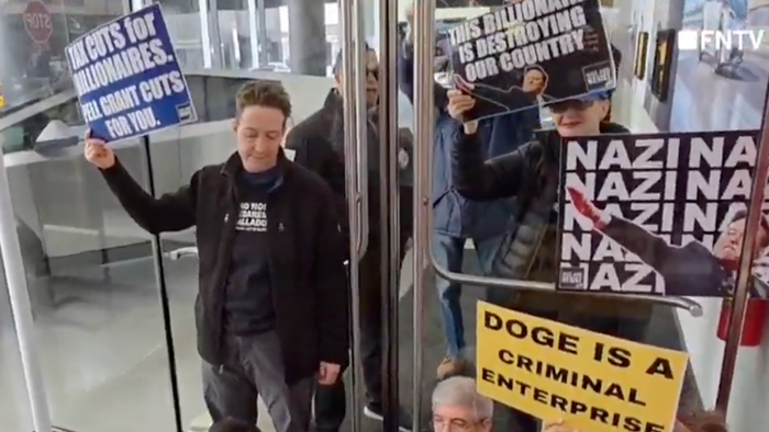 NextImg:Deranged Leftists Storm Manhattan Tesla Showroom, Chant "Zelenskyy Is Hero"