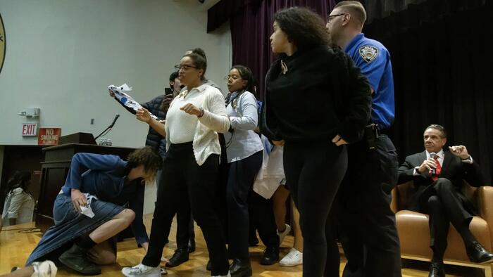 NextImg:'Cuomo Lied, New Yorkers Died!' - Protesters Storm Stage At Mayor Candidate Forum