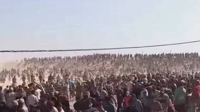 NextImg:Watch: American Contractors Throw Stun Grenades At Gazans Outside Aid Site
