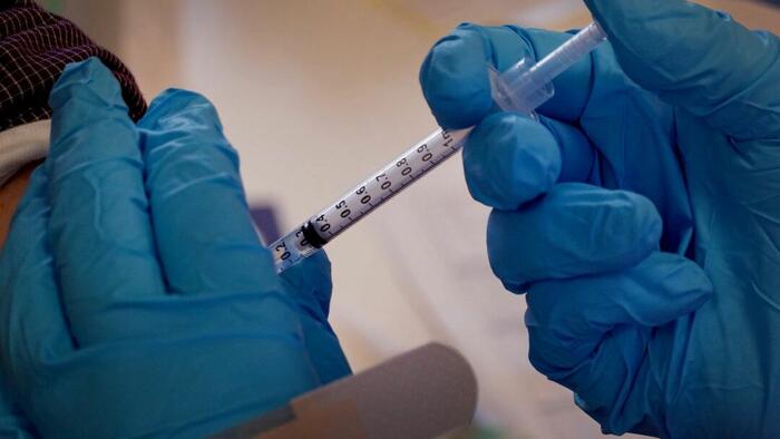 Health Care System To Pay More Than $1 Million To Settle COVID-19 Vaccine Mandate Case