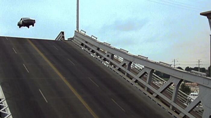 NextImg:Carjacking Suspect Jumps Over Open Drawbridge To Escape Police