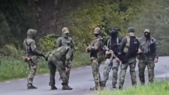 NextImg:Unusual Appearance Of Armed 'Mystery' Russian Men On Estonia's Border Raises NATO Alarm