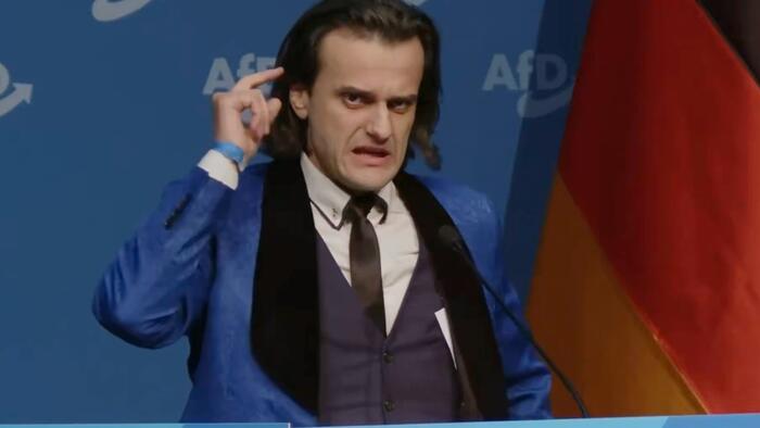 Undercover Agent? Left-Wing Satirist? Questions Swirl After Fiery ‘Hitler-Like’ Speech At AfD Youth Congress Undercover Agent? Left-Wing Satirist? Questions Swirl After Fiery ‘Hitler-Like’ Speech At AfD Youth Congress