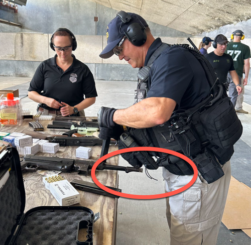 Twitter Roasts ATF For Posting Image Of Agent Loading Nazi Gun Pointed At Testicles 
