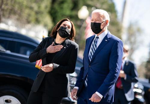 President Joe Biden walks with Vice President Kamala Harris