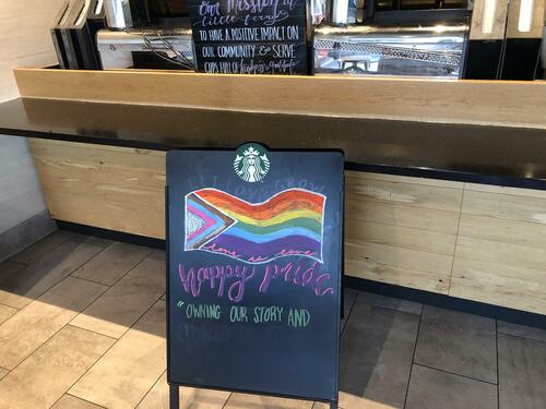 A gay pride sign at Starbucks