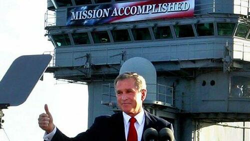 George Bush in front of the "Mission Accomplished" banner on the aircraft carrier.