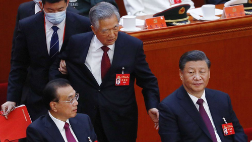 Hu Jintao getting forcibly removed from the Chinese Communist Party Congress.