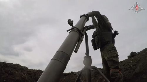 Russian soldiers train with a mortar. 
