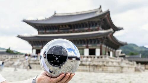 Worldcoin Orb in front of a traditional Korean building. 