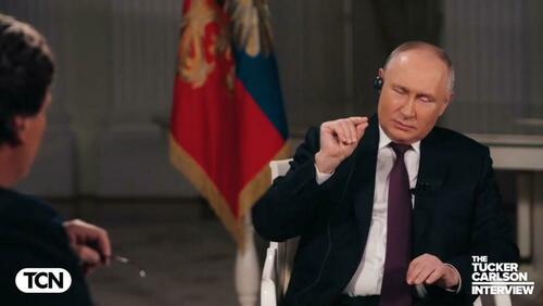 Vladimir Putin being interviewed by Tucker Carlson
