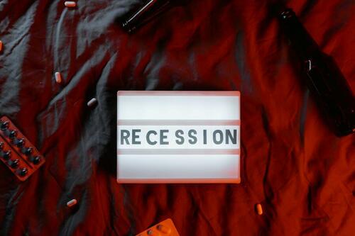 The word "Recession" on a lightbox. 