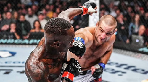 UFC Middleweight Champion Sean Strickland (right) knocking down the man he took the title from, Israel Adesanya.