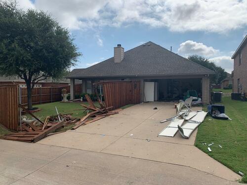 Vicki Baker's damaged house after the SWAT team attacked it