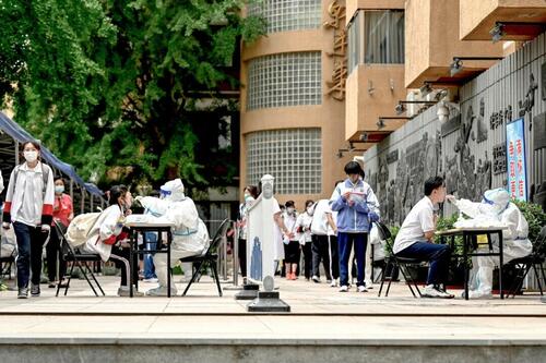 Schools In China Reportedly Isolate Students As COVID Cases Surge thumbnail