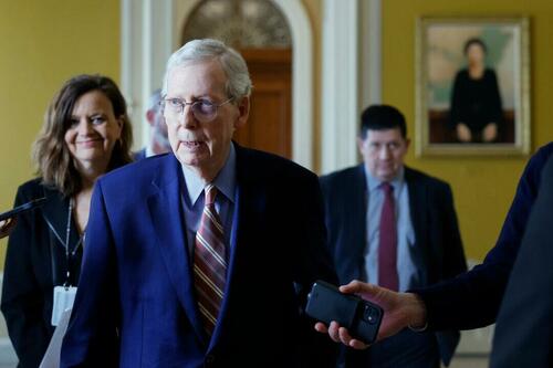 U.S. Senate Minority Leader Mitch McConnell (R-Ky.) is followed by reporters as he leaves the office of Majority Leader Chuck Schumer (D-N.Y.) at the Capitol Building in Washington on Feb. 26, 2024. (Anna Moneymaker/Getty Images)